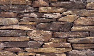 Bluffstone is a narrow ledge stone in height with lengths from 7in to 21in. Its average size is 3in high by 14in long. Available in a warm palette of tinted neutral grays, wine and hints of apricot, its perfect for a tight, dry stacked look. Corners available.